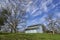 A Pale Blue Dutch Barn, surrounded by Pecan Trees on Property near Richmond, Texas.