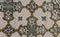 pale elegant intricate decorative arabesque inlay reliefs ceiling marble dark reflective glass pearl tiles pattern