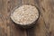 Pale malt barley in a glass bowl, an ingredient for beer.