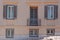 Pale ocher and gray house exterior, Plaka old neighborhood, Athens Greece