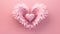 Pale pink heart decorated with pale pink feathers on a pink background