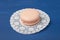Pale pink macaroni. Cookies, macaroni on a white napkin.