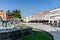 Palencia, Spain - August 21, 2021. Fountain and white balconies in Plaza de Espana, Aguilar de Campoo, Palencia, Spain