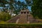 Palenque, Chiapas, Mexico: Ancient Mayan pyramid with steps among the trees in Sunny weather