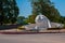 Palenque, Chiapas, Mexico. The name written by the city of Palenque, huge colorful letters. White head sculpture on the street.