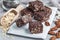 Paleo chocolate energy bars with rolled oats, pecan nuts, dates, chia seeds and coconut flakes