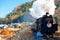The Paleo Express hauled by a steam locomotive travels on Seibu Chichibu Railway thru the idyllic countryside with fall colors
