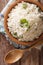 Paleo Food: Cauliflower rice with herbs close-up. Vertical top v