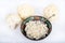 Paleo organic vegetarian food cauliflower rice in a floral rustic bowl, on white background