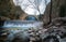 Paleokarya old stone arched bridge between two waterfalls. Trikala prefecture, Greece