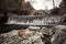 Paleokarya old stone arched bridge between two waterfalls. Trikala prefecture, Greece