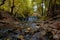 Paleokarya, old, stone, arched bridge, between two waterfalls. Trikala prefecture, Thessaly, Greece