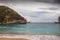 Paleokastritsa beach with Kolyviri island background on a rainy day