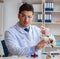 Paleontologist looking at extinct animal bone