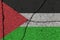 Palestine flag on cracked concrete wall. The concept of crisis, war, conflict, terrorism or other problems in the