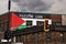 Palestine flag and free palestine palestine libre slogan painted on the brick walls of a building in Montreal, Canada