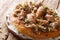 Palestinian chicken with sumac and onions served with taboo bread close-up on a plate. horizontal