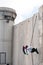 Palestinian climbs Israeli separation wall