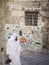 Palestinian man in old town alley scene of jerusalem israel