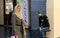 A Palestinian merchant stands wearing a health face mask, due to fears of spread of COVID-19 coronavirus disease, outside his clot