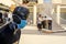 A Palestinian merchant stands wearing a health face mask, due to fears of spread of COVID-19 coronavirus disease, outside his clot