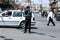 The Palestinian police organizes the traffic wearing a precautionary mask against the Coronavirus