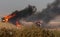 Palestinian protesters clash with Israeli forces during a protest at the Israel-Gaza border