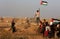 Palestinian protesters clash with Israeli forces during a protest at the Israel-Gaza border