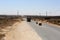 Palestinian security officers stand next to Palestinian trucks at a checkpoint before heading to the Israeli side at the Kerem Sha