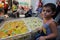 Palestinian sells colorful chicks in the market to birds in order to attract children to buy them as a source of earning money