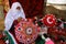 Palestinian woman, is practicing the profession of embroidery, which she inherited from her ancestors more than 30 years ago