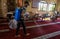 Palestinian youth performs cleansing work, a amid the outbreak of the Coronavirus Covid19, in the `Badr` mosque before the first