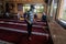Palestinian youth performs cleansing work, a amid the outbreak of the Coronavirus Covid19, in the `Badr` mosque before the first