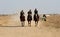 Palestinians attend a local horse racing on the land of the destroyed Gaza International Airport