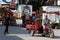 Palestinians pass by a mural depicting the late Palestinian leader Yasser Arafat, in Gaza