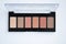 Palette of eye shadow  on white background. Samples of brown nude make