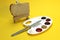 The palette includes mayonnaise, ketchup, mustard, jam and two types of jam with bread and a knife. Near an easel with bread