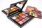 palette with variety of eye shadows, blushes and lipsticks