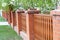 Palisade fence with brick columns