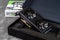 Palit Nvidia Geforce RTX 3060 Ti Dual OC gaming graphics card in an open box against dark background. Modern desktop pc hardware