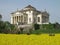 Palladio\'s Villa La Rotonda with a yellow field of rapeseed in Vicenza, Italy