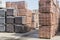 pallets with bricks in the building store. Racks with brick. Masonry, stonework. Several pallets with concrete brick stacked on to