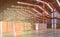 Pallets of cargo stack in distribution warehouse with high rack shelf background