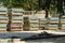 Pallets with paving slabs prepared for laying at a city road construction site on a sunny summer day. Repair of roads and