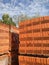 Pallets with red building bricks, building material