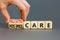 Palliative or hospice care symbol. Concept word Palliative care Hospice care on wooden cubes. Doctor hand. Beautiful grey table