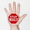 On the palm of the hand there is a stop sign with the inscription - STOP MEASLES. Isolated on white background