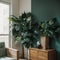 Palm leaf on a modern, teal sideboard with drawers in a luxurious, green living room interior with golden decorations and an uphol