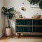 Palm leaf on a modern, teal sideboard with drawers in a luxurious, green living room interior with golden decorations and an uphol