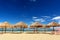 Palm parasol on the beach in a sunny day